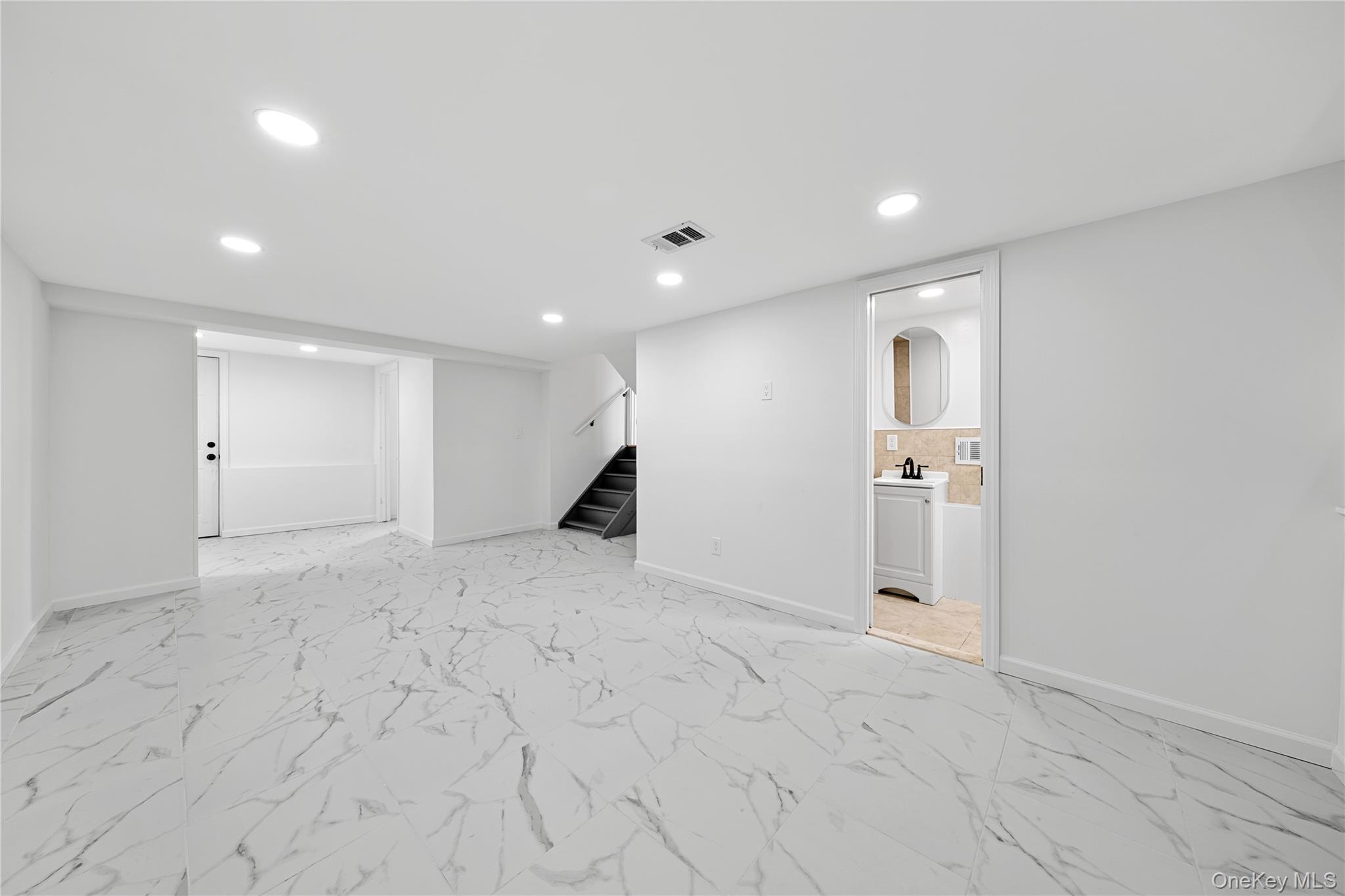 78 Layton Street Freeport, NY 11520 - Photo 16 of 22 a view of a livingroom with a staircase