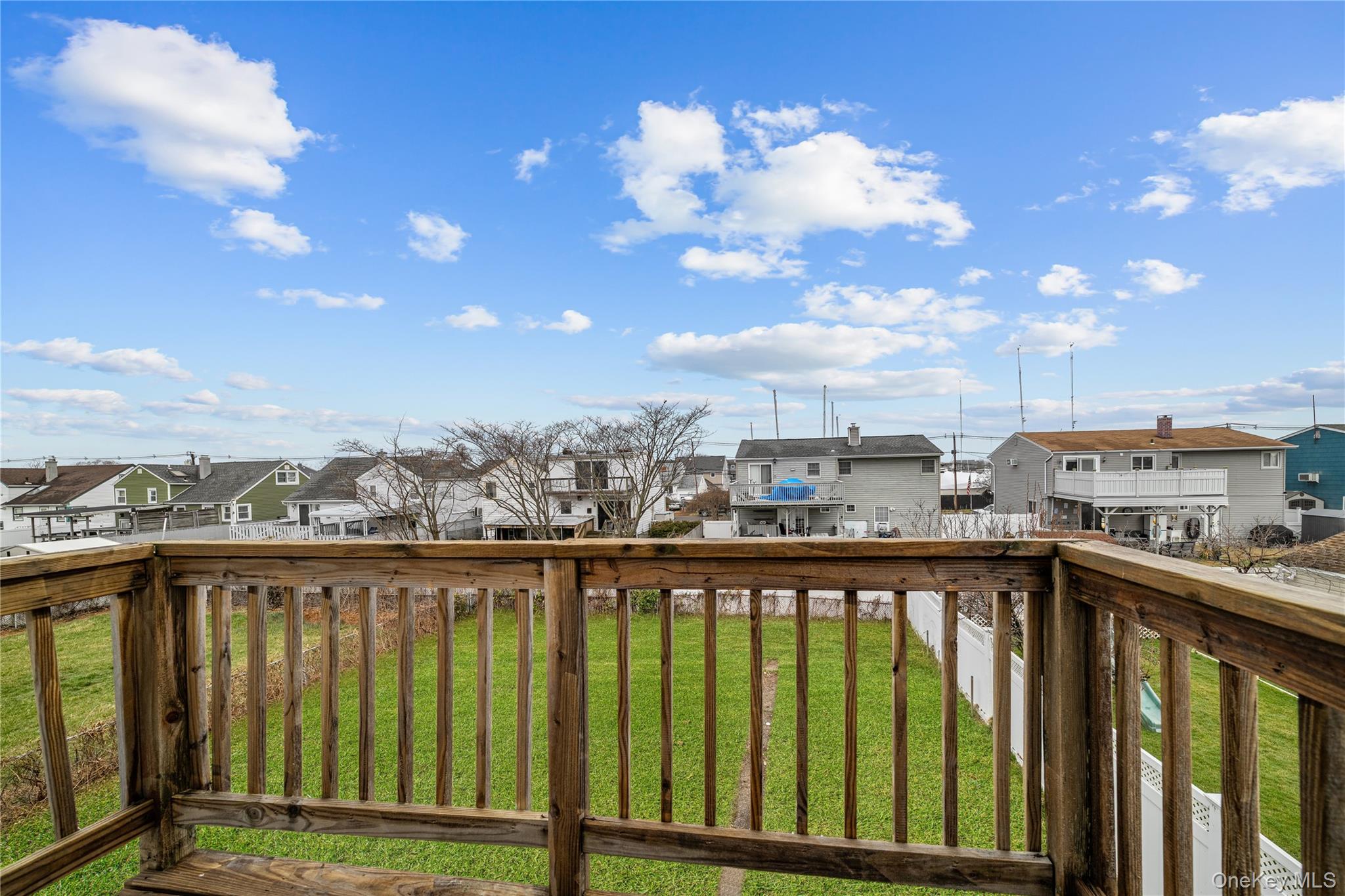 78 Layton Street Freeport, NY 11520 - Photo 4 of 22 a view of city from a balcony