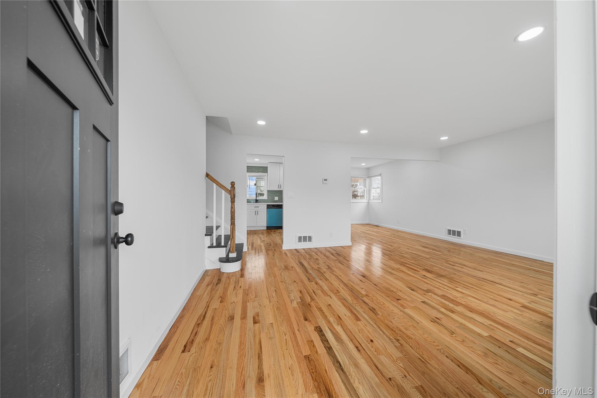 78 Layton Street Freeport, NY 11520 - Photo 5 of 22 a view of empty room with wooden floor