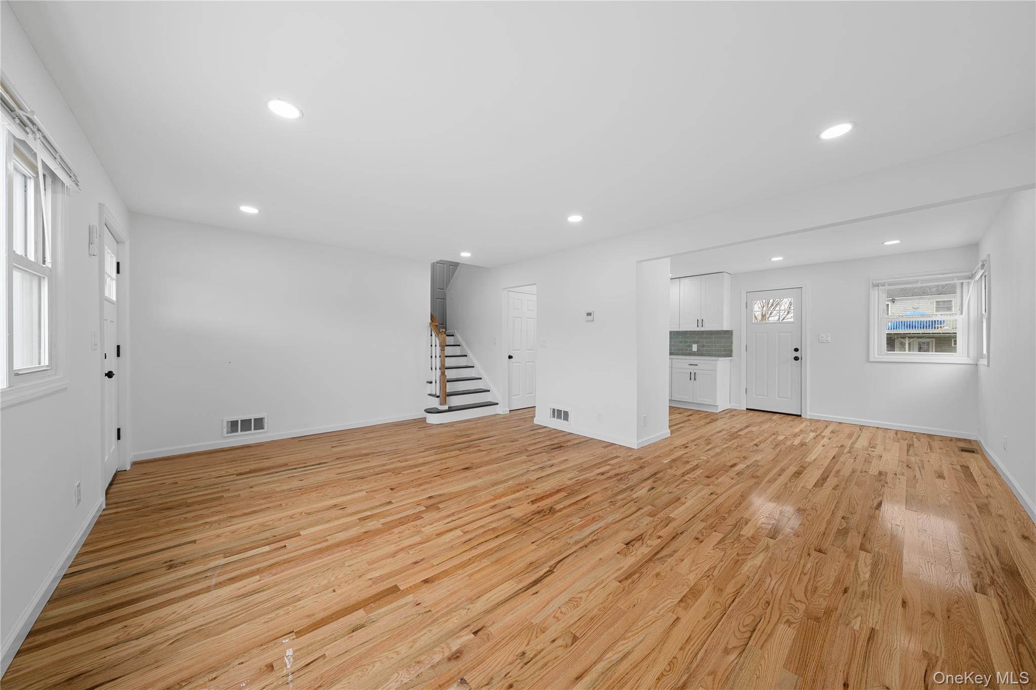 78 Layton Street Freeport, NY 11520 - Photo 6 of 22 a view of empty room with wooden floor