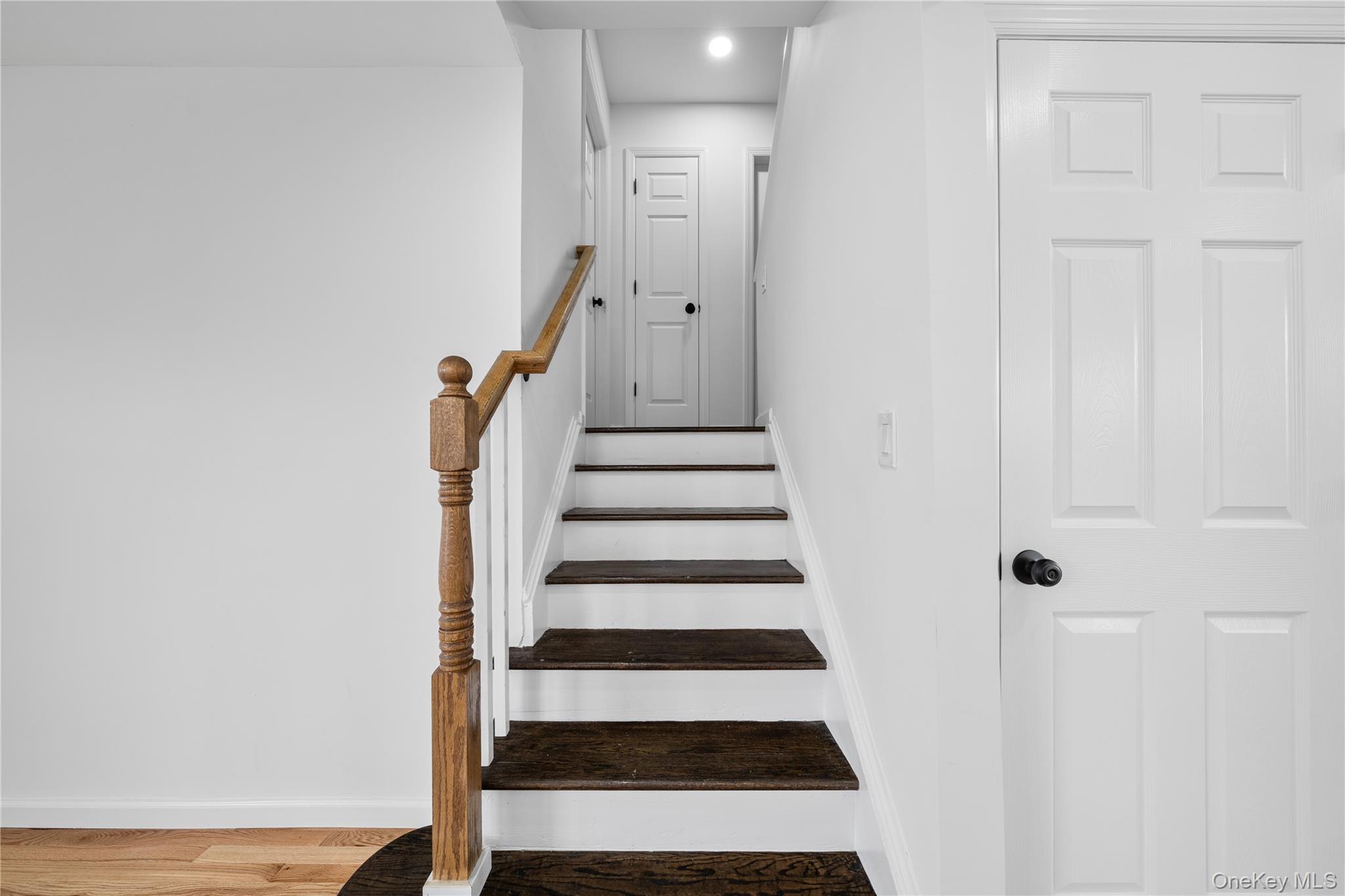78 Layton Street Freeport, NY 11520 - Photo 9 of 22 a view of a room with wooden floor and white walls
