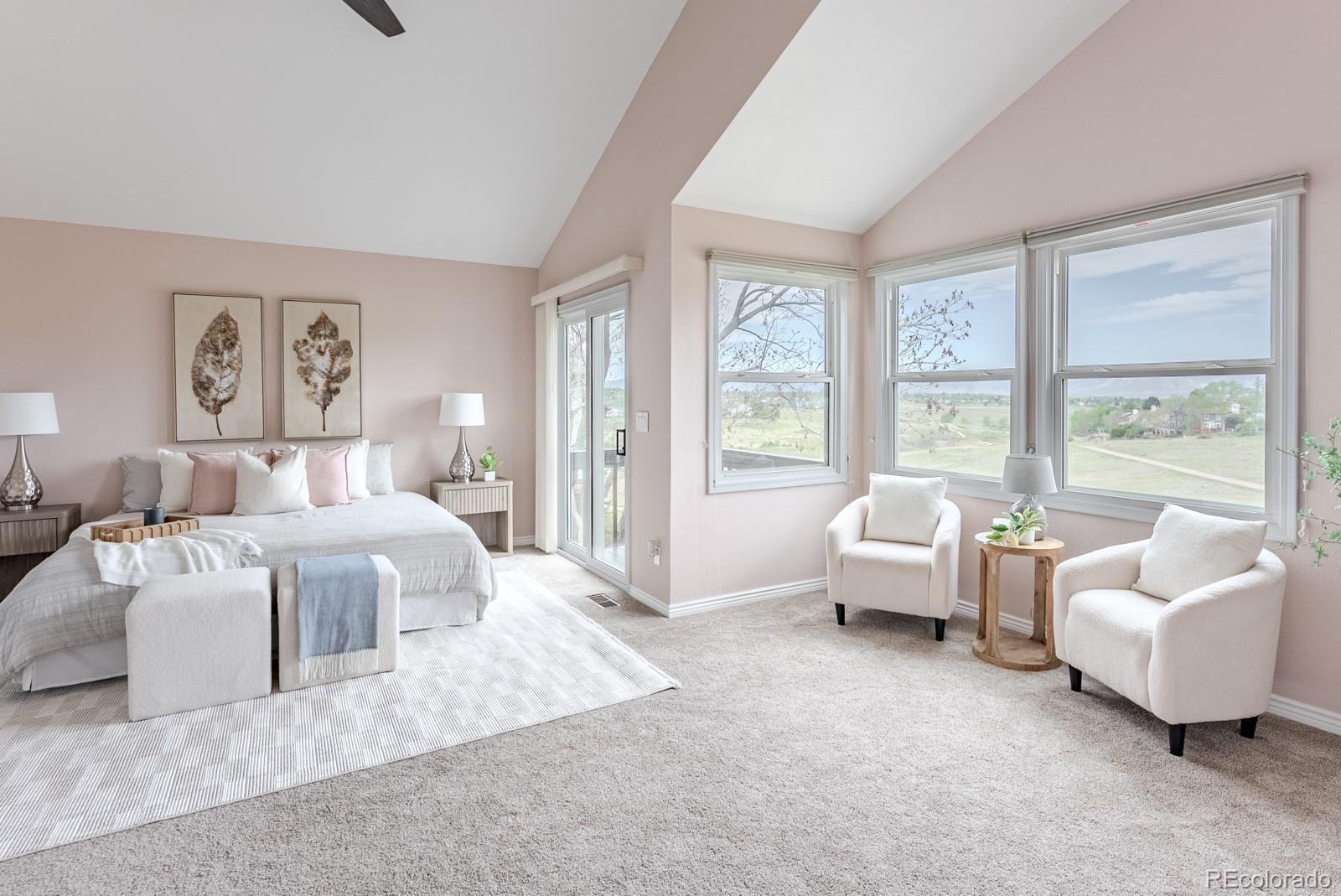 1914 Terrace Drive Highlands Ranch, CO 80126 - Photo 18 of 47 a spacious bedroom with a bed and glass couch