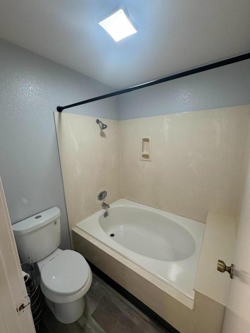 741 Pointe Pacific Drive, Unit 10 Daly City, CA 94014 - Photo 16 of 24 a white bath tub sitting next to a toilet