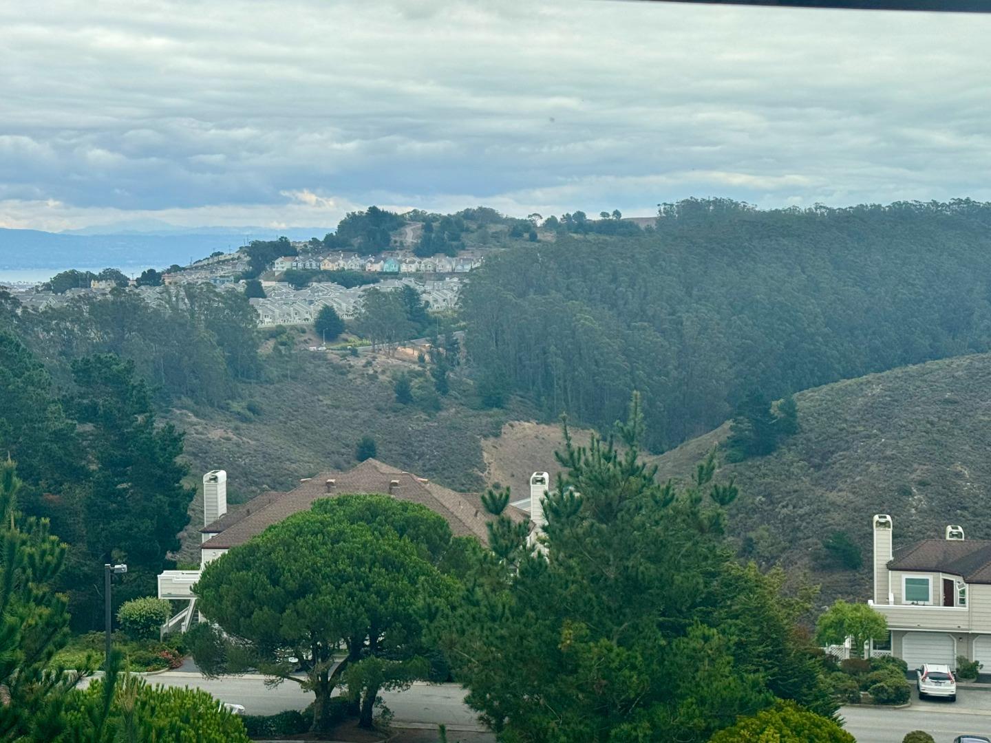 741 Pointe Pacific Drive, Unit 10 Daly City, CA 94014 - Photo 20 of 24 a view of a lake with a mountain