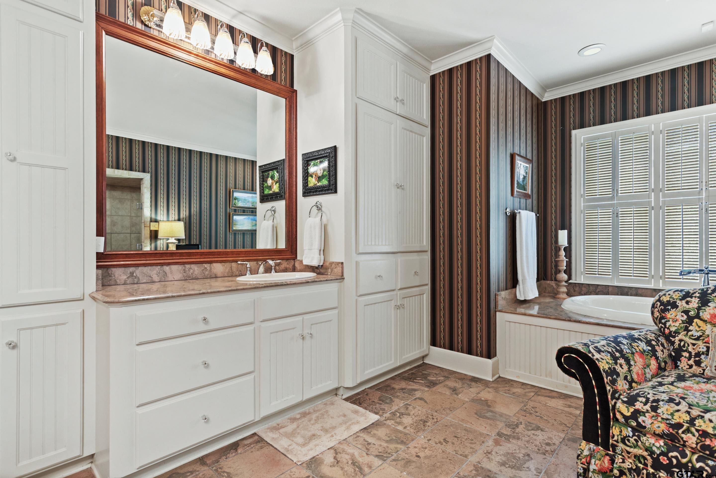 2631 Old Bullard Road Tyler, TX 75701 - Photo 22 of 43 a bathroom with a granite countertop sink and a mirror