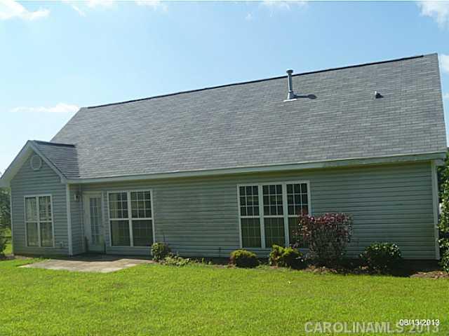 2214 Dawn Ridge, Unit 50 Monroe, NC 28110 - Photo 2 of 16 a front view of a house with a yard and garage