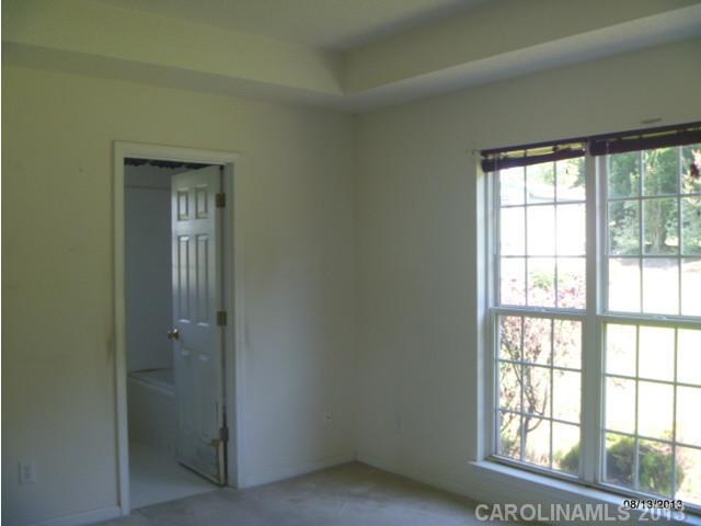 2214 Dawn Ridge, Unit 50 Monroe, NC 28110 - Photo 11 of 16 an empty room with windows