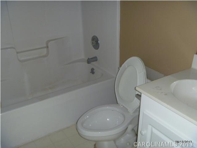 2214 Dawn Ridge, Unit 50 Monroe, NC 28110 - Photo 14 of 16 a bathroom with a toilet and a sink