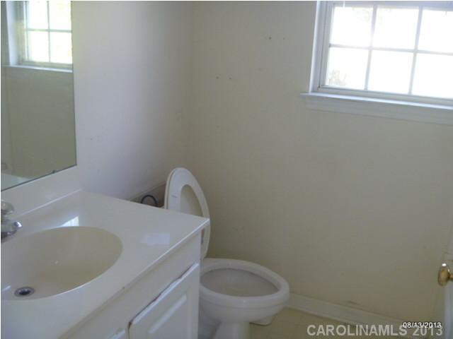 2214 Dawn Ridge, Unit 50 Monroe, NC 28110 - Photo 15 of 16 a bathroom with a toilet and a sink