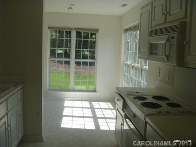 2214 Dawn Ridge, Unit 50 Monroe, NC 28110 - Photo 9 of 16 a kitchen area with a stove