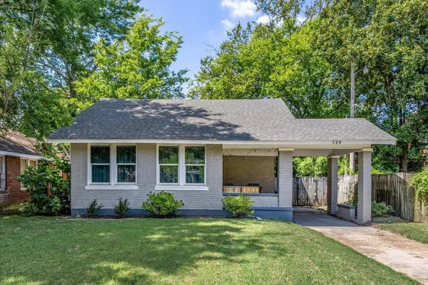 front view of a house with a yard