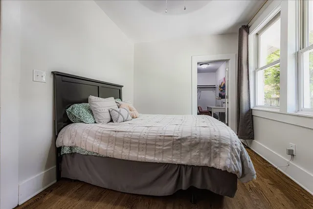 a bedroom with a bed and window