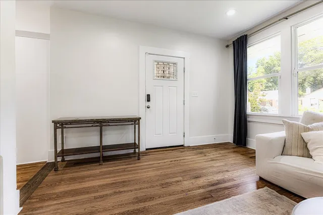 a view of room with window and wooden floor