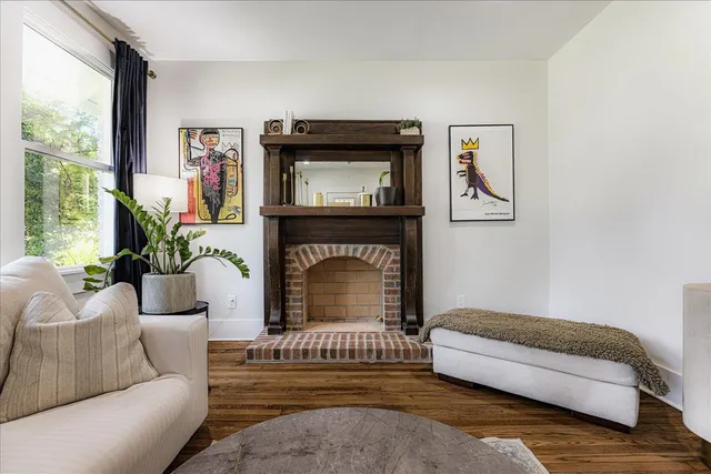 a living room with furniture and a fireplace