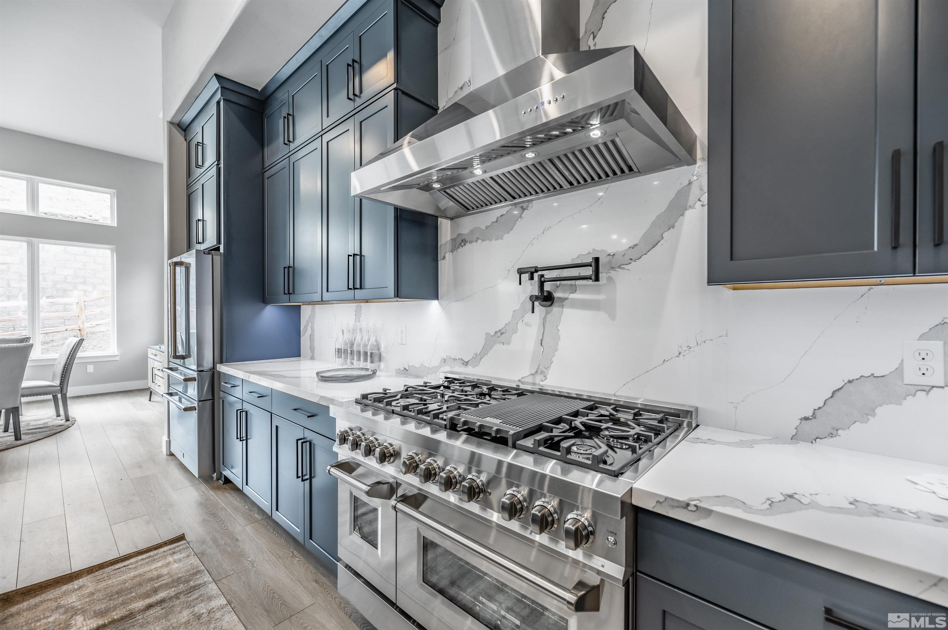1592 River Hill Way, Unit HOMESITE 16 Reno, NV 89523 - Photo 15 of 35 a kitchen with a stove and a wooden floor