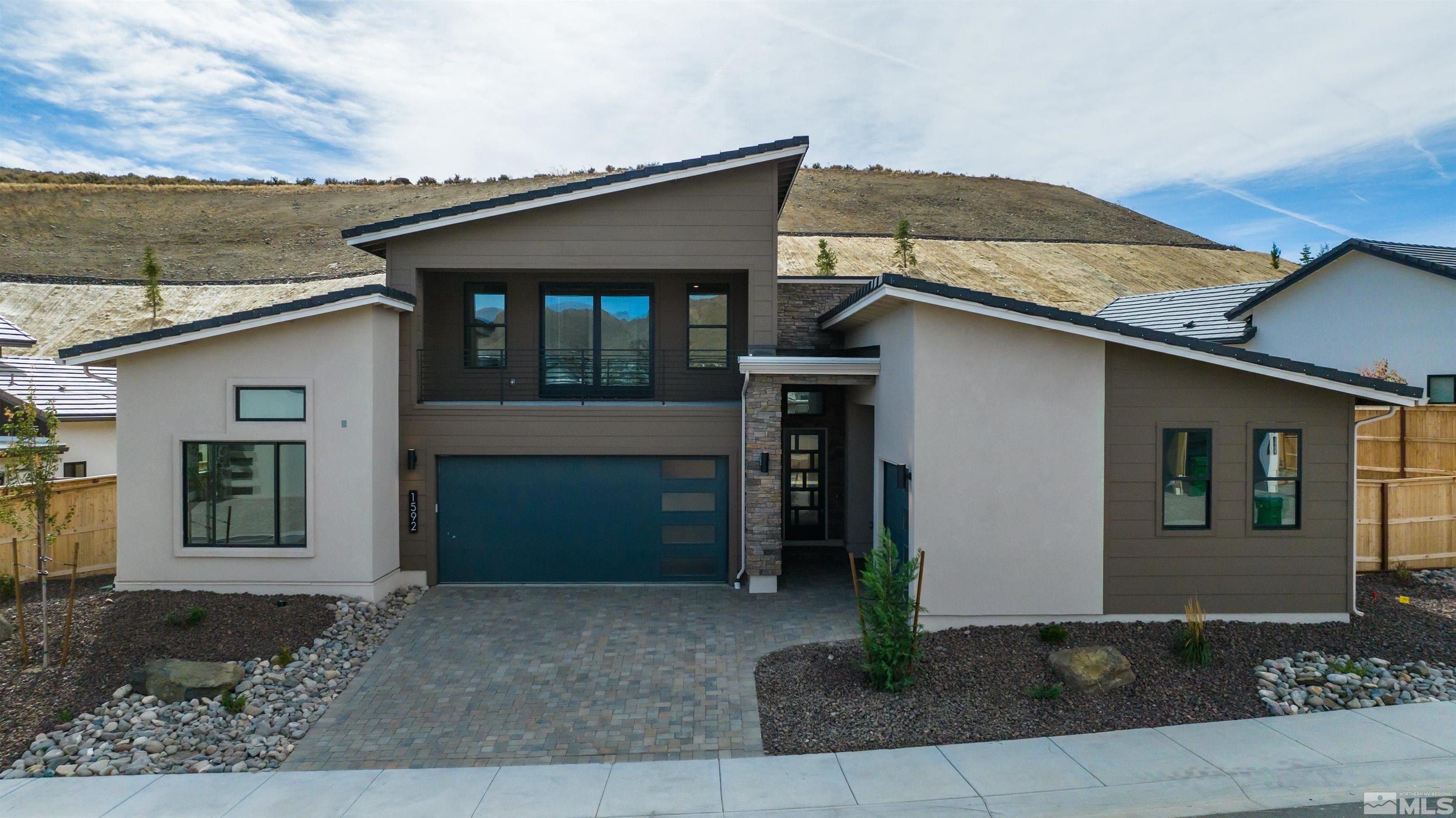 1592 River Hill Way, Unit HOMESITE 16 Reno, NV 89523 - Photo 2 of 35 a front view of a house with garden