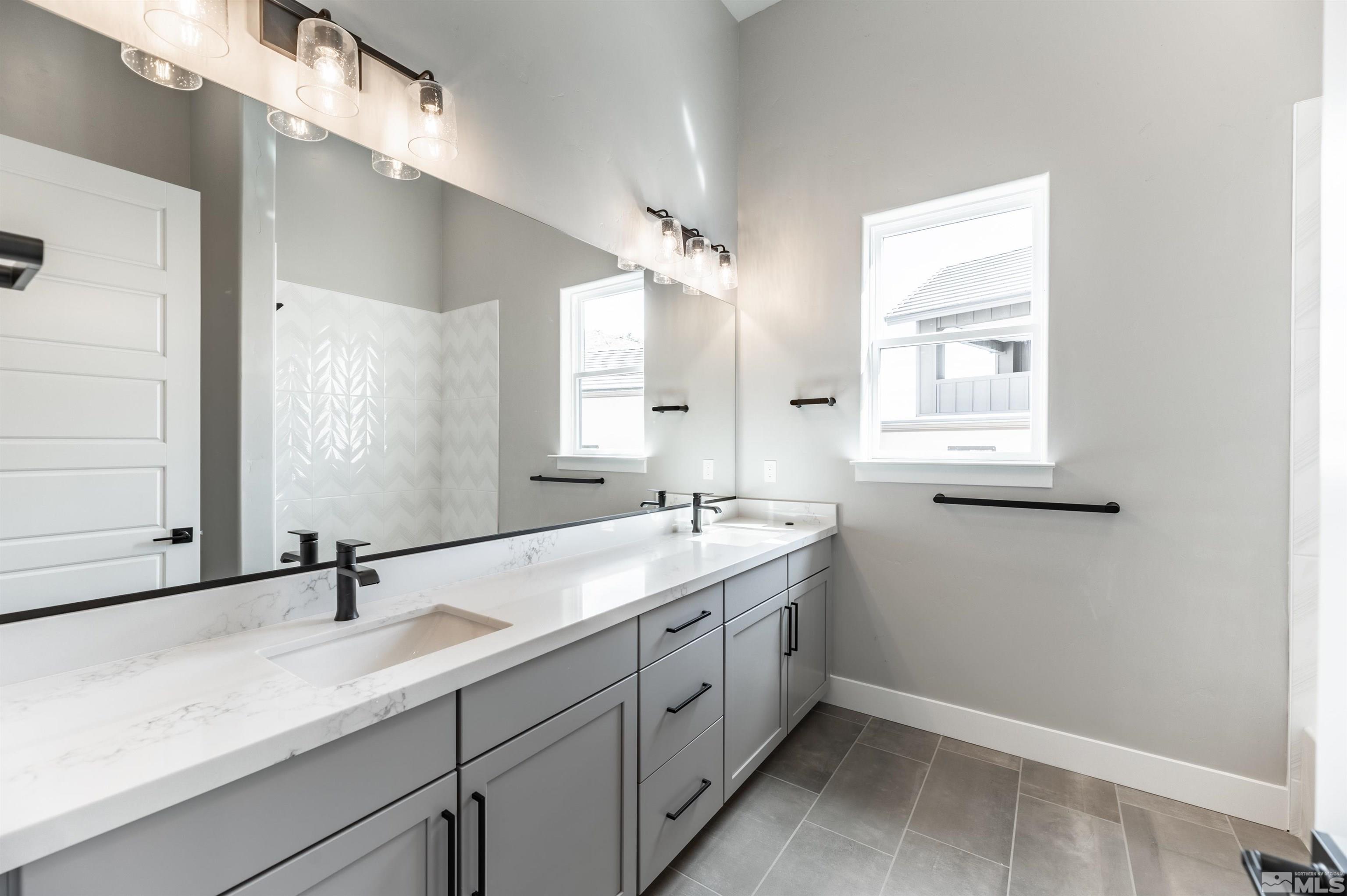 1592 River Hill Way, Unit HOMESITE 16 Reno, NV 89523 - Photo 27 of 35 a bathroom with a sink and a mirror