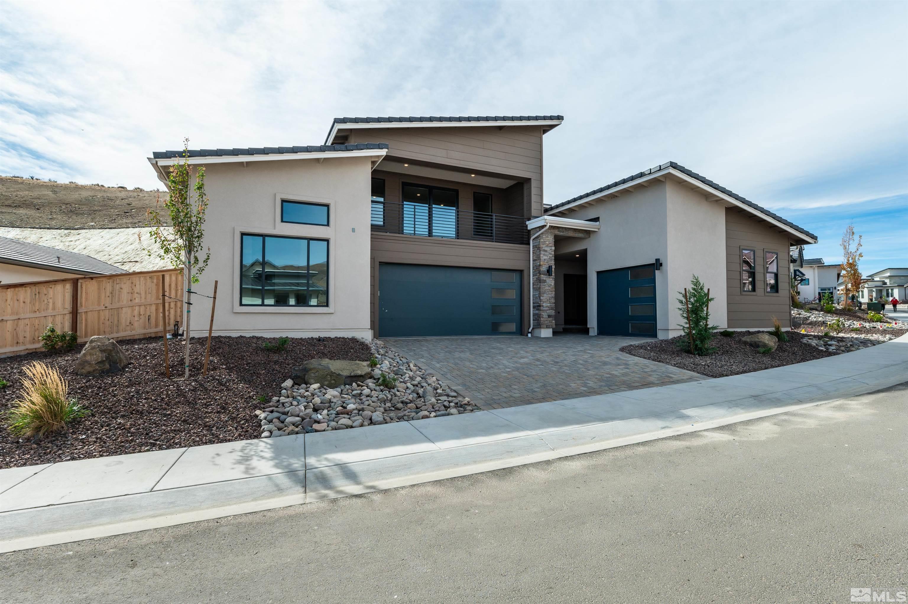 1592 River Hill Way, Unit HOMESITE 16 Reno, NV 89523 - Photo 4 of 35 a front view of a house with a yard and garage