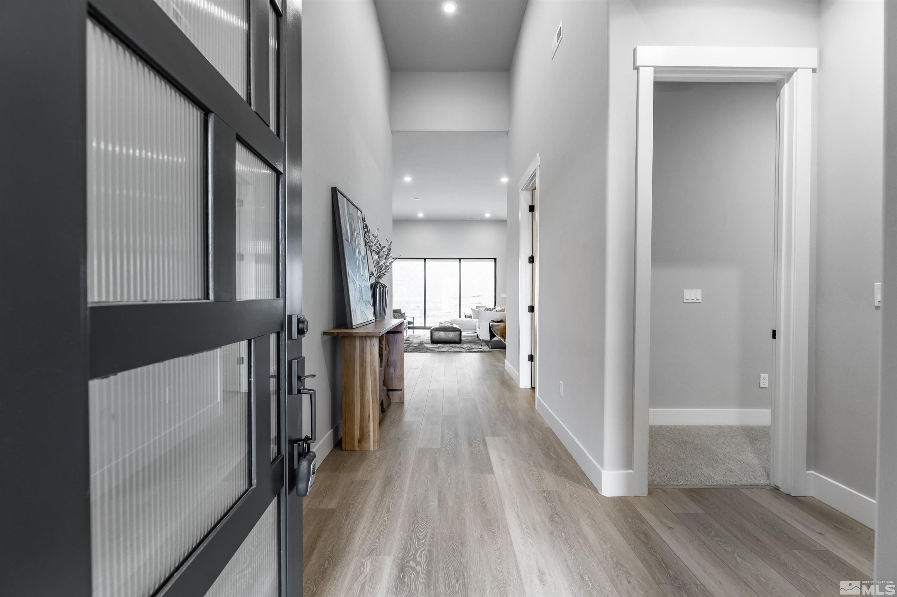 1592 River Hill Way, Unit HOMESITE 16 Reno, NV 89523 - Photo 6 of 35 a view of a hallway view with wooden floor and staircase