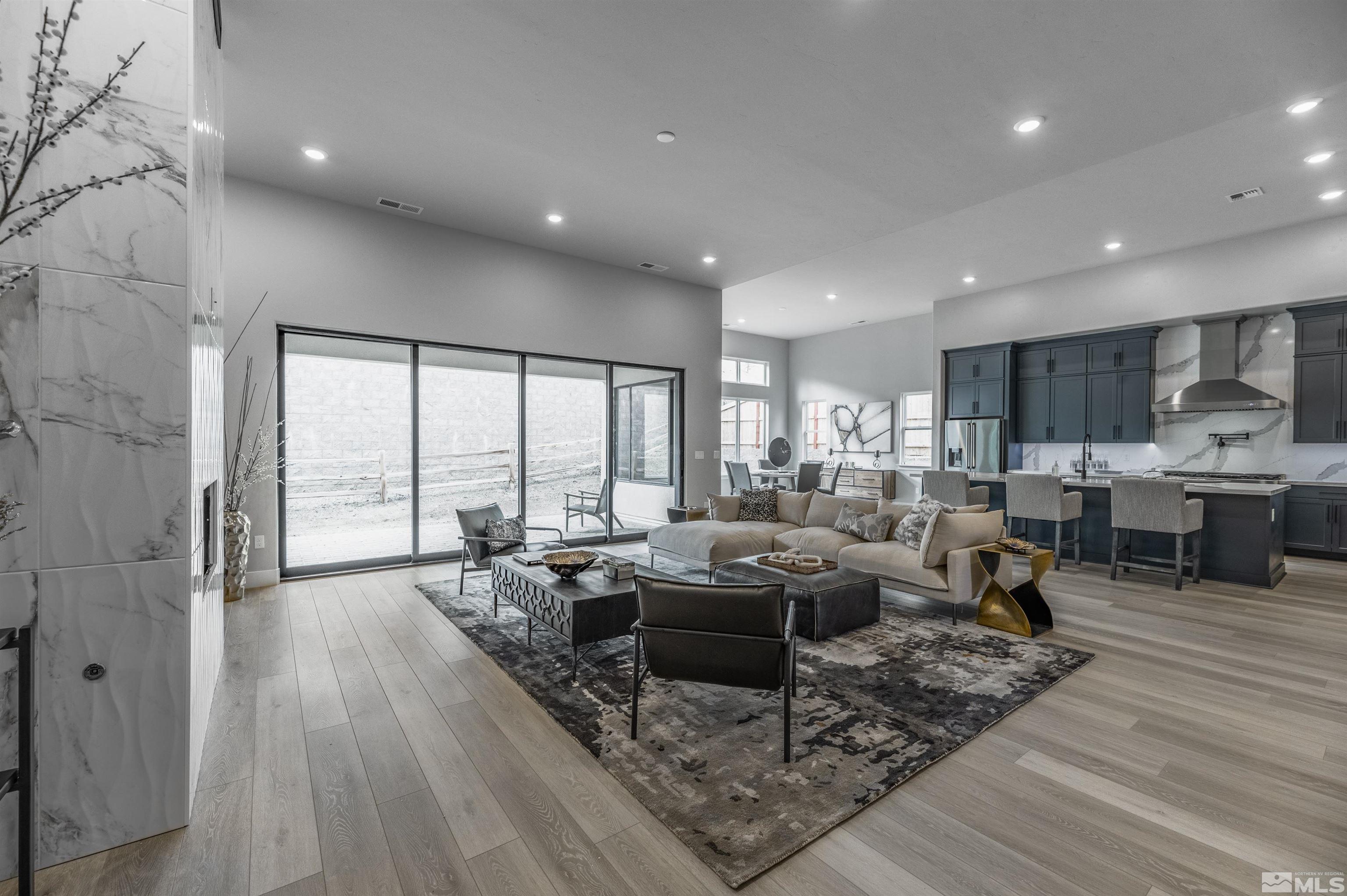 1592 River Hill Way, Unit HOMESITE 16 Reno, NV 89523 - Photo 10 of 35 a living room with furniture large wooden floor and a large window
