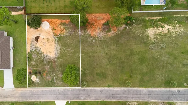 a view of a yard from a balcony