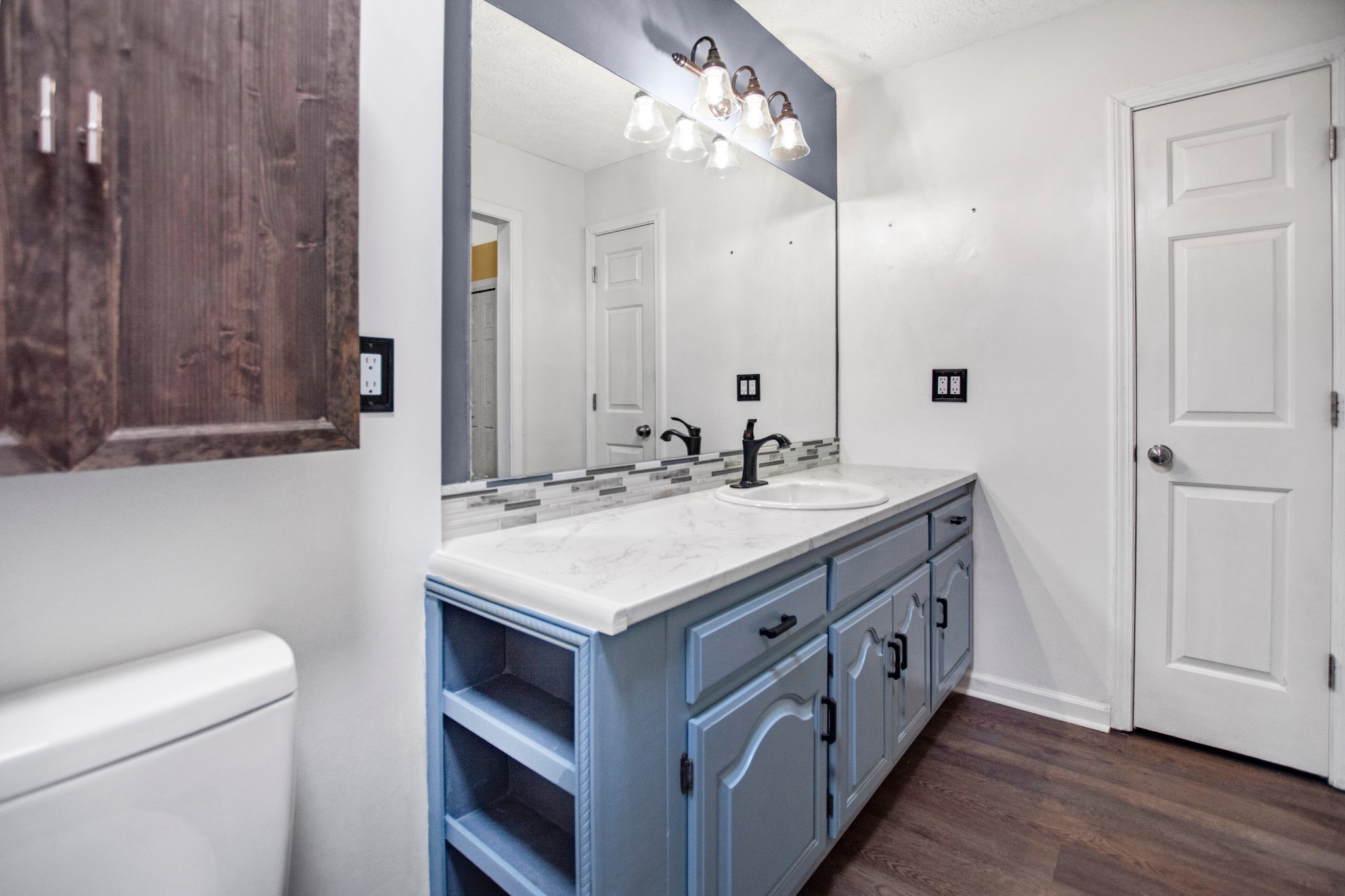 128 South Richview Road Clarksville, TN 37043 - Photo 13 of 19 a bathroom with a double vanity sink and a mirror