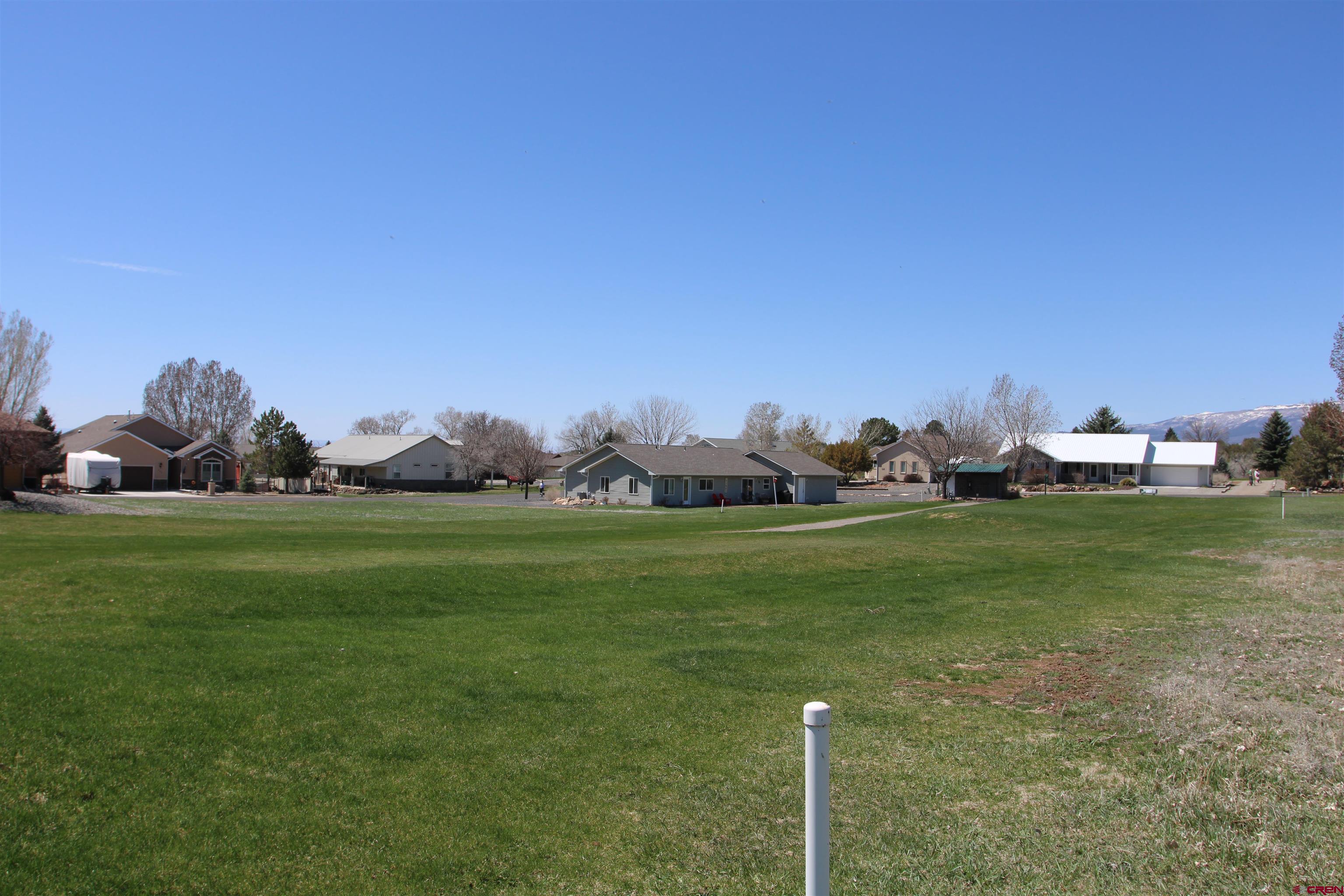 950 Southeast Fairway Drive Cedaredge, CO 81413 - Photo 16 of 20 a front view of a house with garden