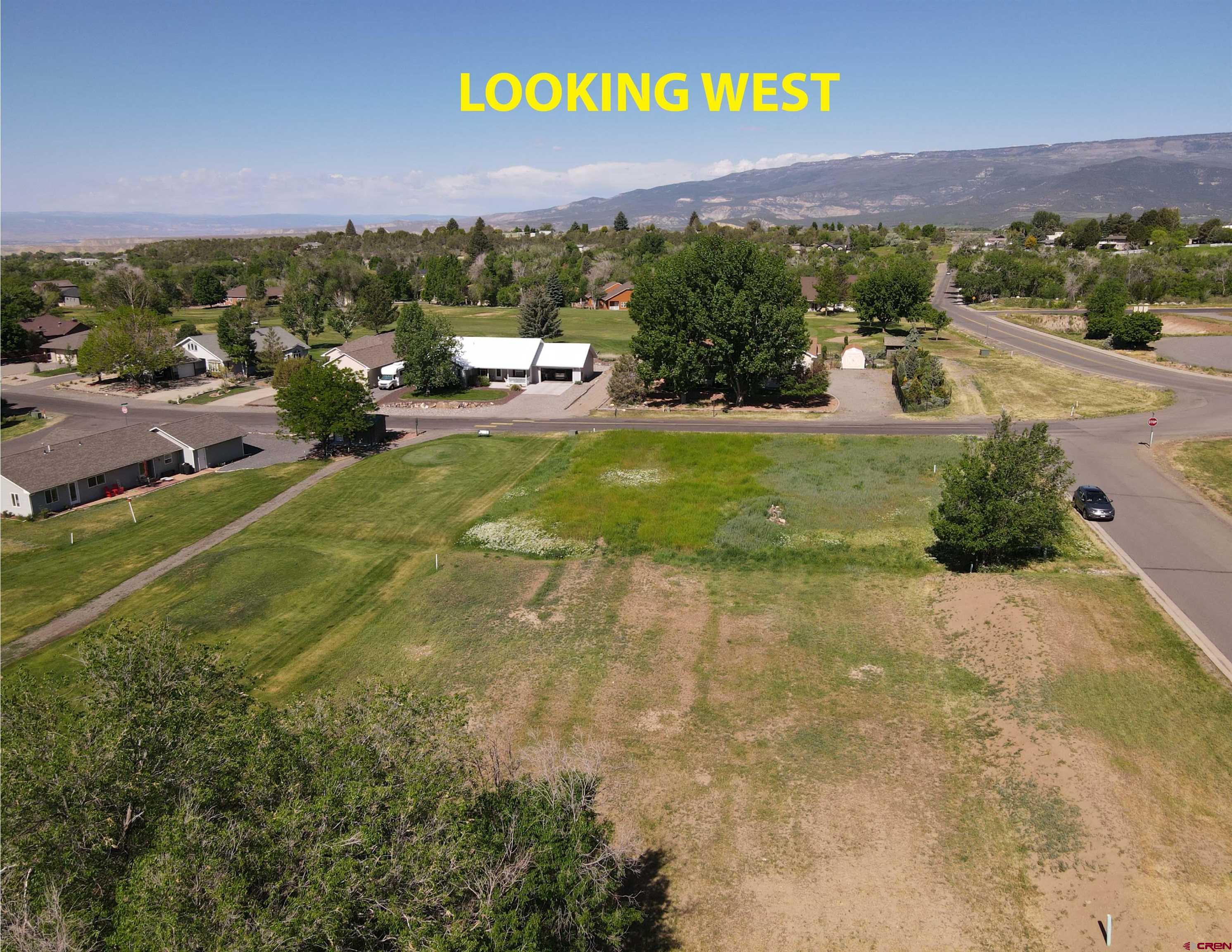 950 Southeast Fairway Drive Cedaredge, CO 81413 - Photo 5 of 20 a view of a street with a houses in the background