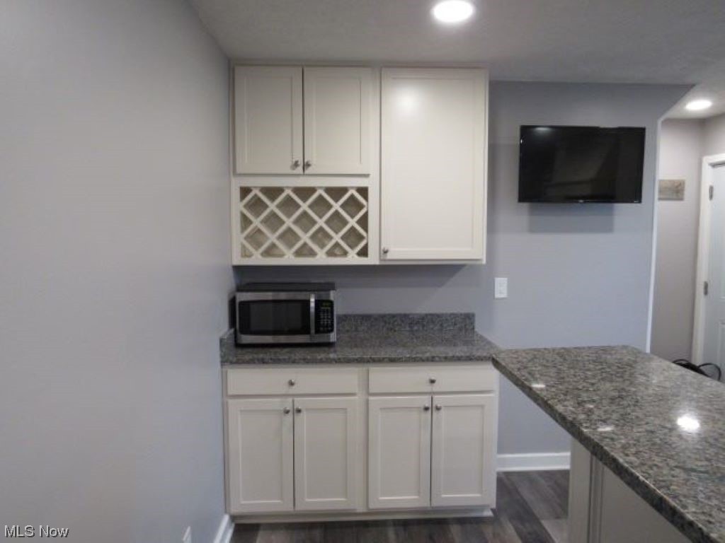 8528 Lafayette Road Lodi, OH 44254 - Photo 6 of 22 Kitchen with white cabinets, granite counterops