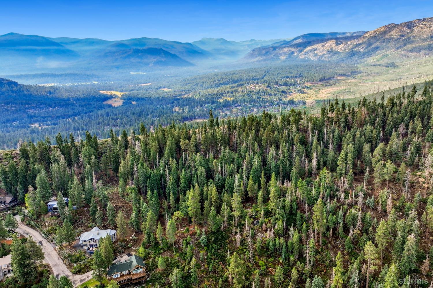 350 Glenmore Way South Lake Tahoe, CA 96150 - Photo 21 of 37 a view of a lush green hillside and a mountain