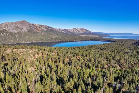 a view of a lake in middle of the forest