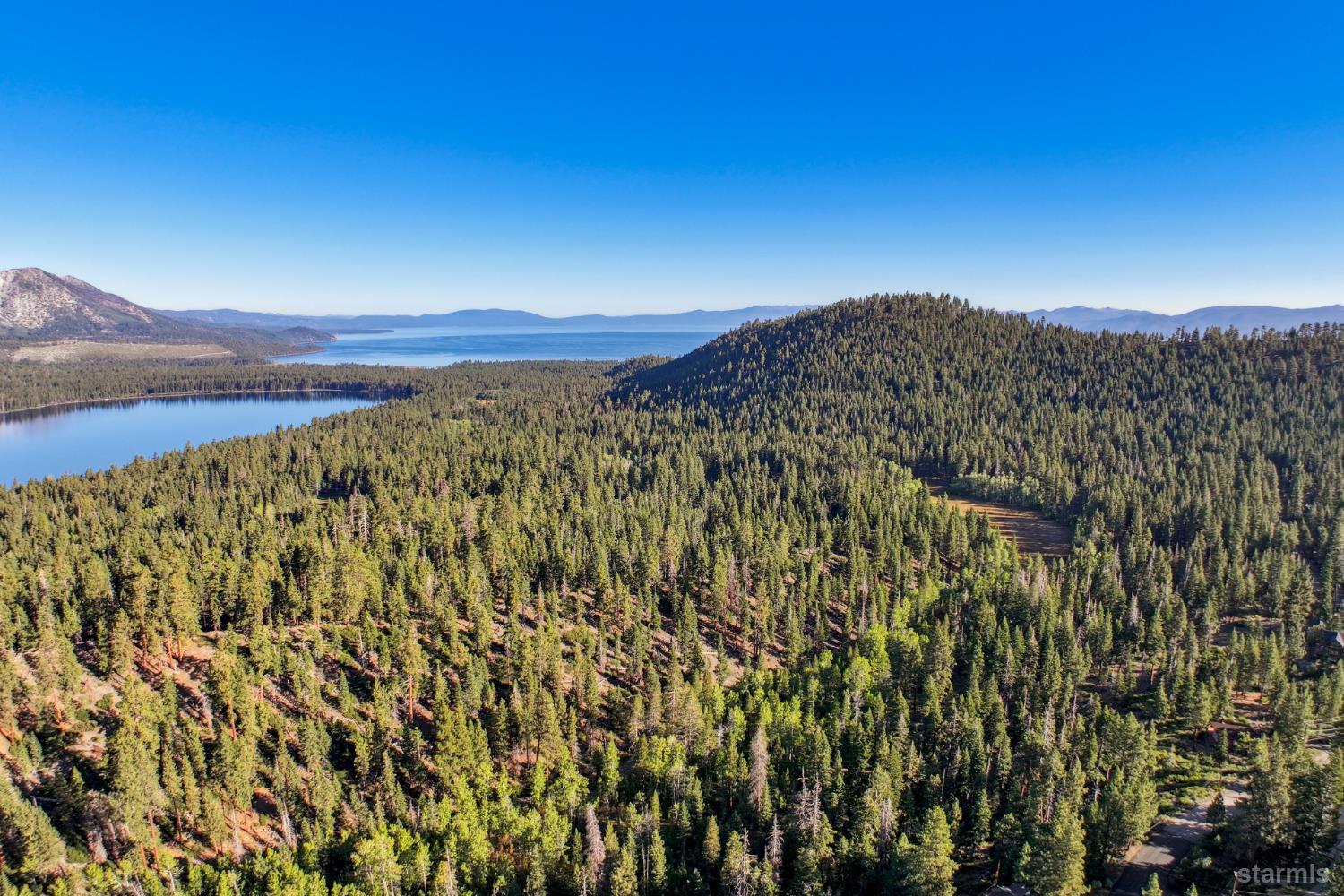 350 Glenmore Way South Lake Tahoe, CA 96150 - Photo 34 of 37 a view of a large building with a mountain in the background