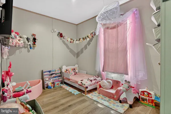 a bedroom with furniture and a bed
