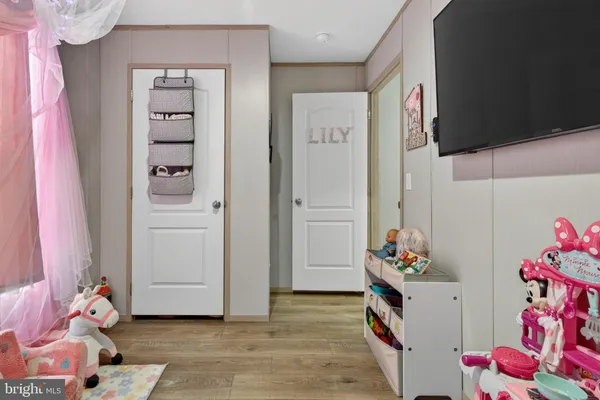 a room with toys and wooden floor