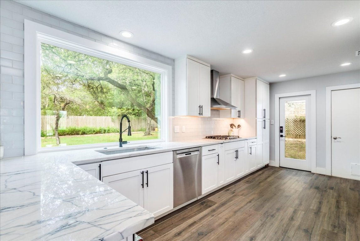 6309 Colina Lane Austin, TX 78759 - Photo 11 of 29 Modern kitchen with amazing view of your private backyard.