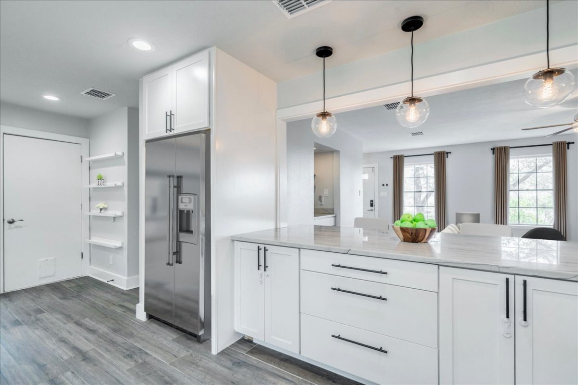 6309 Colina Lane Austin, TX 78759 - Photo 12 of 29 Modern kitchen with amazing view of your private backyard.