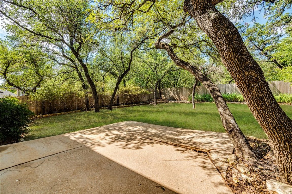 6309 Colina Lane Austin, TX 78759 - Photo 25 of 29 Large, private backyard with oak trees.