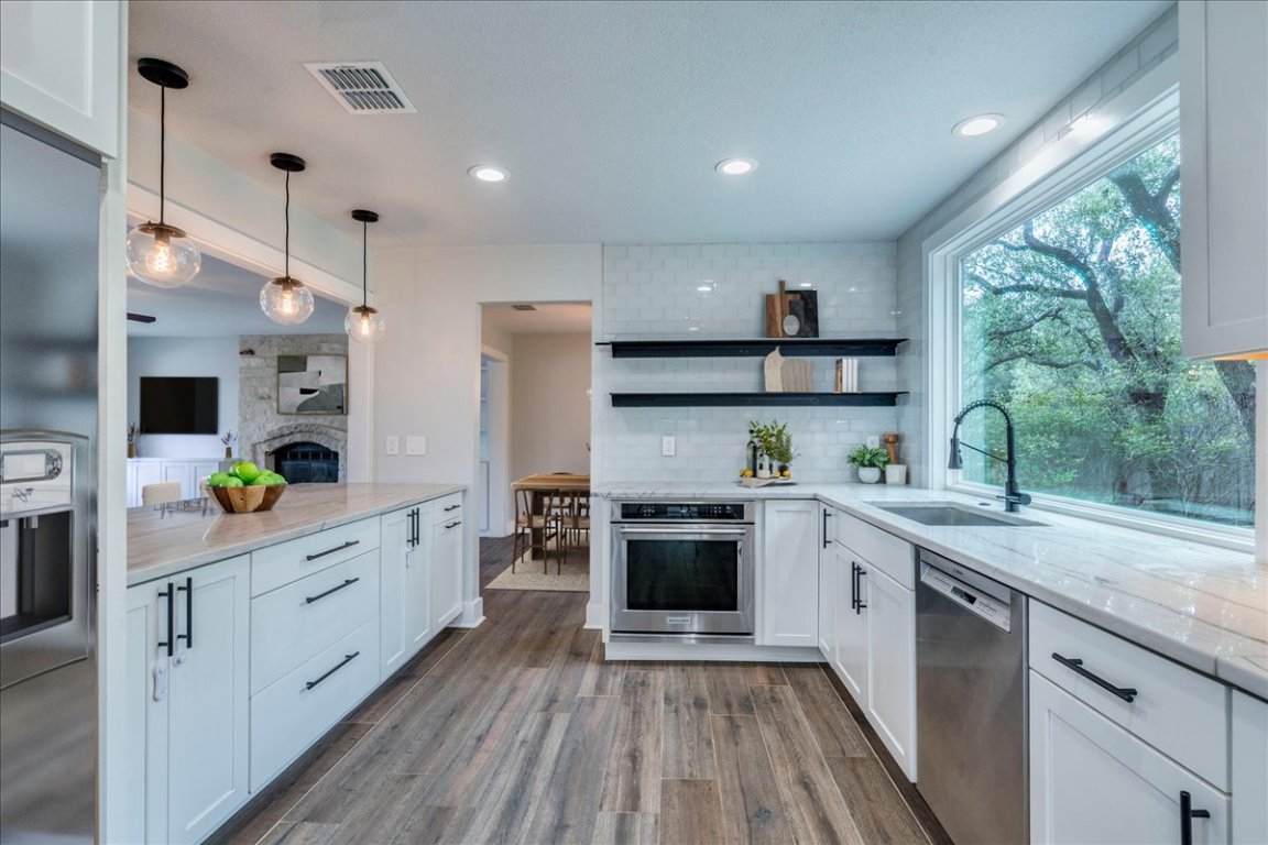 6309 Colina Lane Austin, TX 78759 - Photo 3 of 29 Modern kitchen with amazing view of your private backyard.