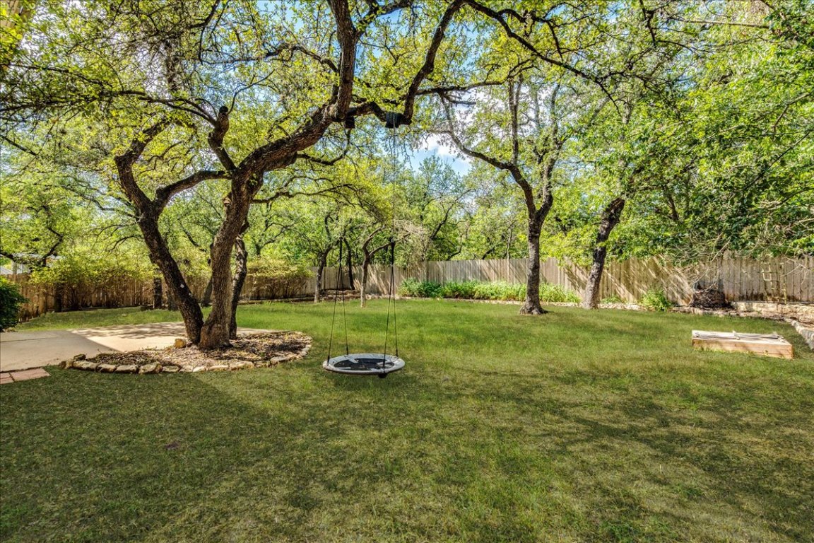 6309 Colina Lane Austin, TX 78759 - Photo 5 of 29 Large, private backyard with oak trees.