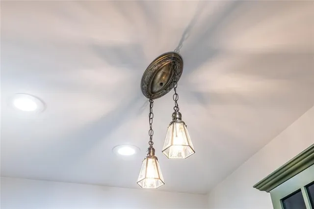 a close view of light fixtures and wooden floor