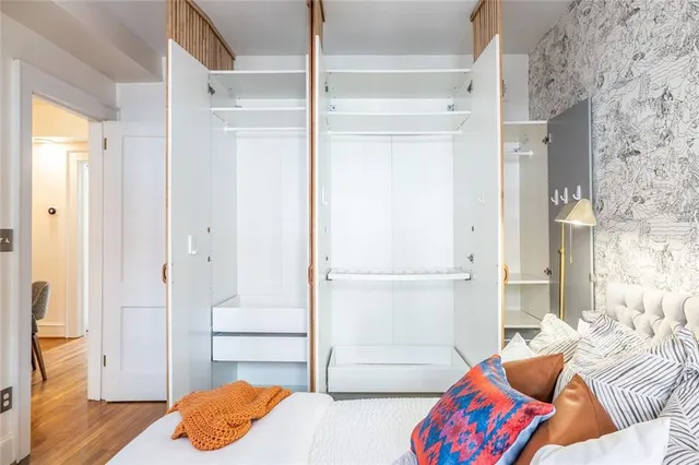 a bedroom with a bed and a couch