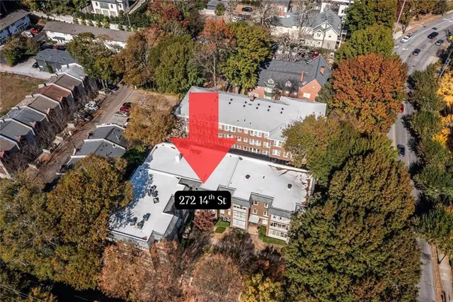 an aerial view of a house with a yard