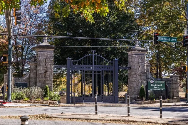 a street sign on a sidewalk next to a road
