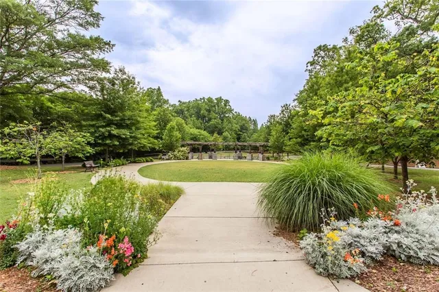 a view of a swimming pool with a yard