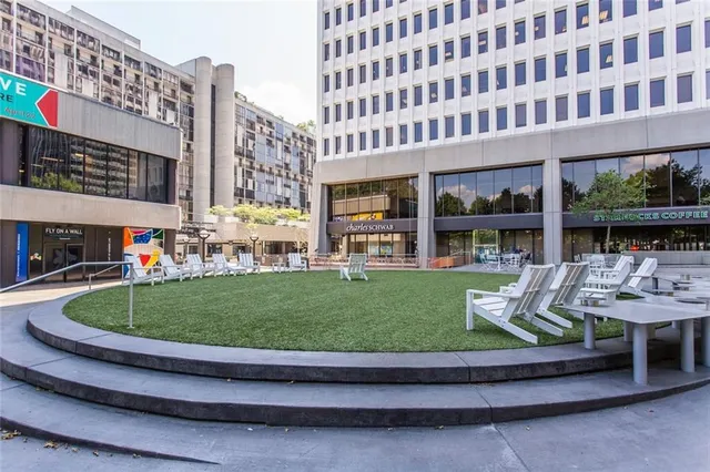 a front view of a building with outdoor seating