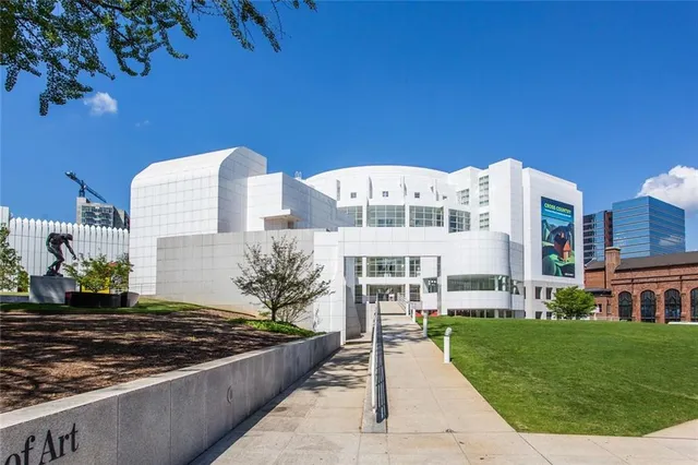 a view of a building with a yard