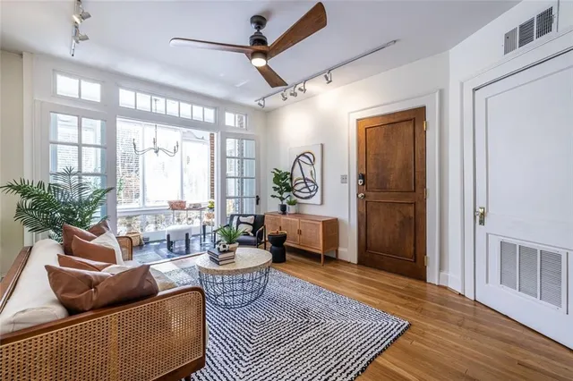 a living room with furniture and a rug