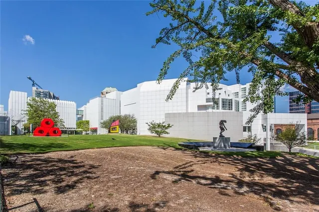 a view of a road with a house in the background