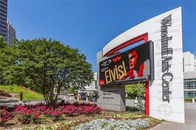 a street sign on a sidewalk in front of building