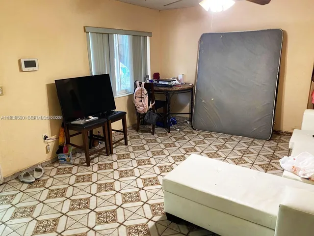 a living room with a couch and a flat screen tv